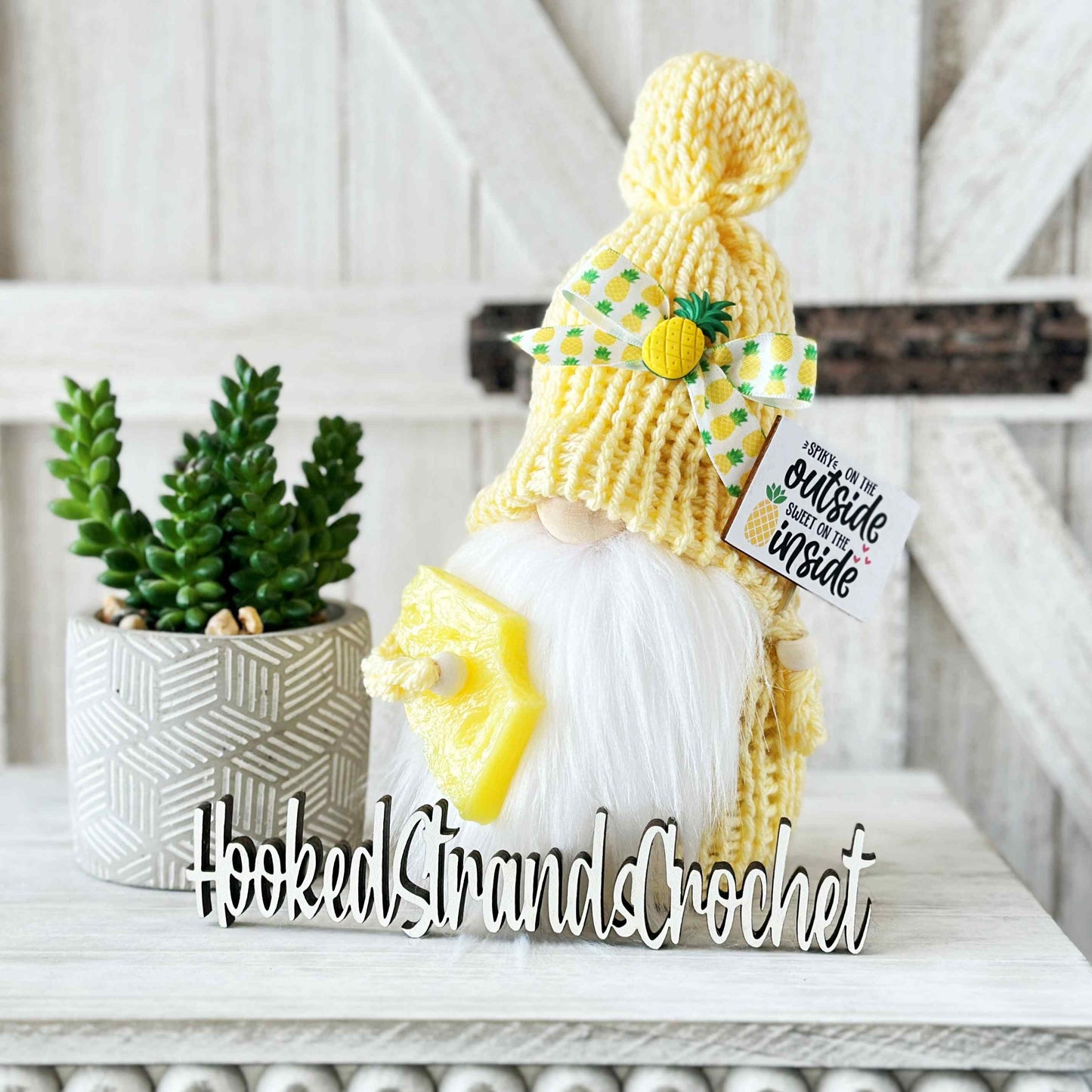 Playful yellow knit pineapple gnome with sign - tiered tray decor